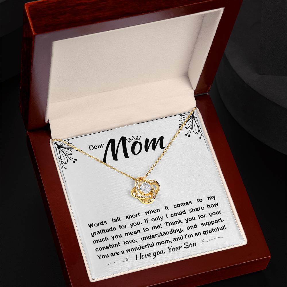 White gold necklace with a love knot pendant and a heartfelt message from a son in a luxury box.