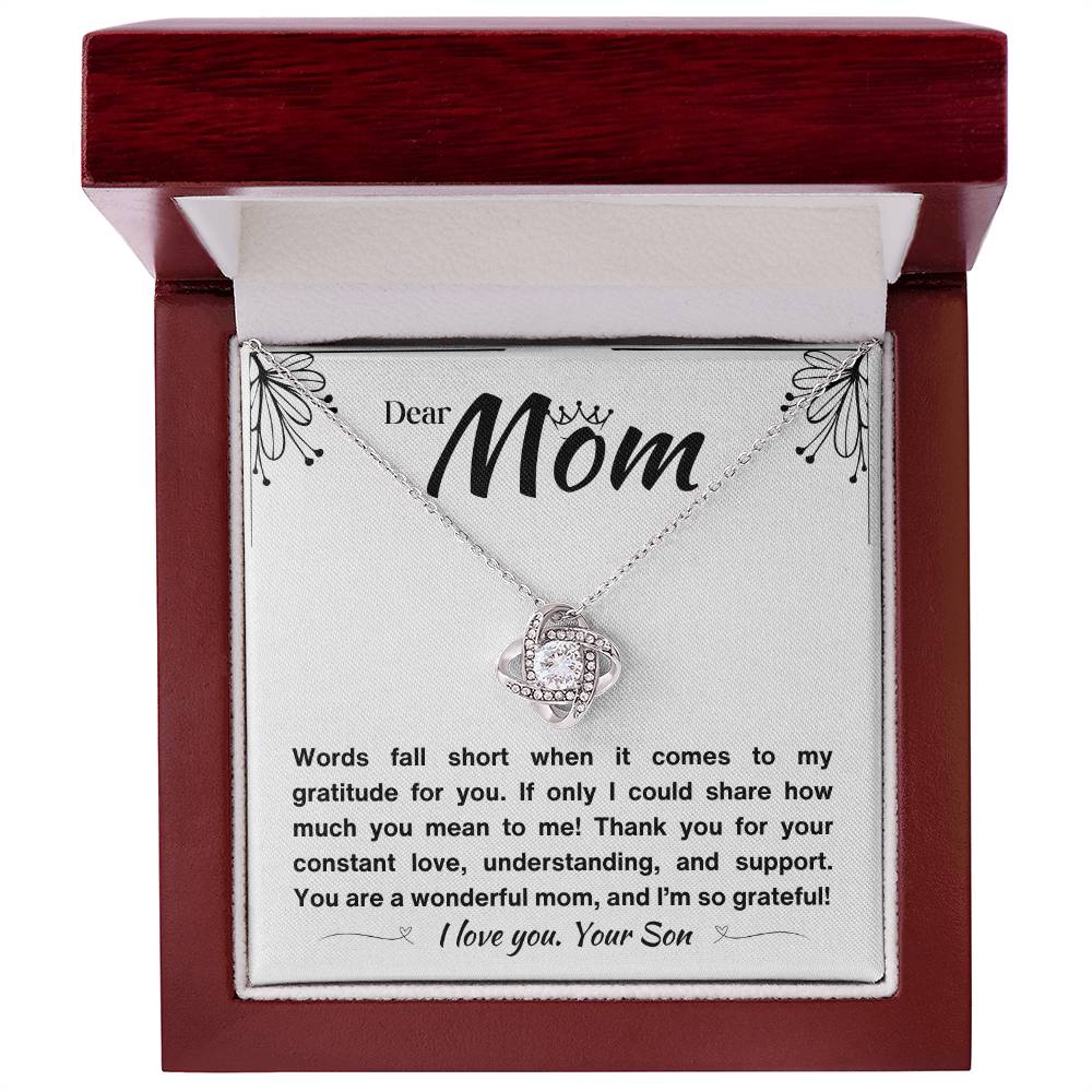 A luxury Gift box with a silver necklace and a loving message for a mom.