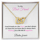 A necklace in a gift box with a message to a best friend. The necklace features two interlocking hearts on gold finish. The message on the box reads: "To My Best Friend, Good Friends are Like Stars, you don't always see them but you know they're always there. Wishing you a life full of happiness. Besties forever."