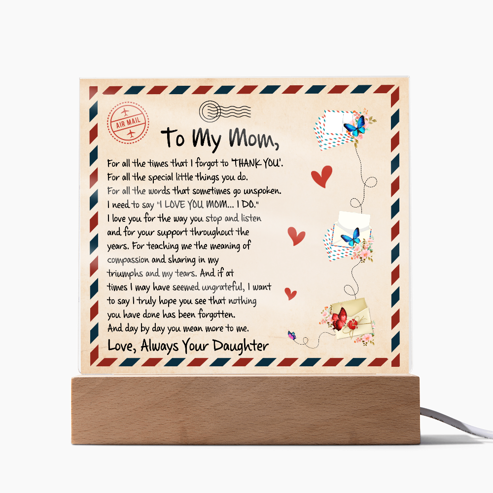 Thoughtful gift for Mom—a vintage airmail-themed plaque with a loving message, butterflies, and a wooden LED base.