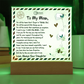 Acrylic plaque with a heartfelt letter to Mom, decorated with butterflies, hearts, and a floral touch 